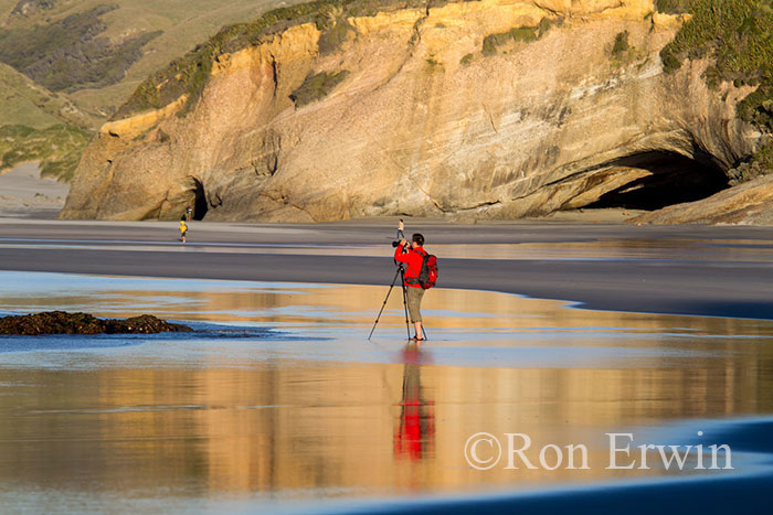 Photographer on Wharariki Beach, New Zealand