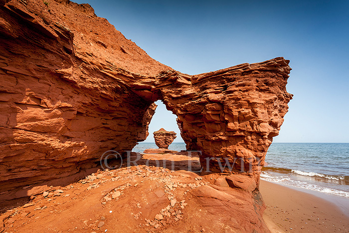 Looking through an archway at Teacup Rock, PEI