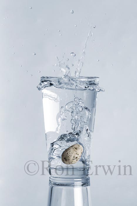 Stones Splashing into Glass