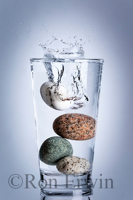Stones Splashing into Glass